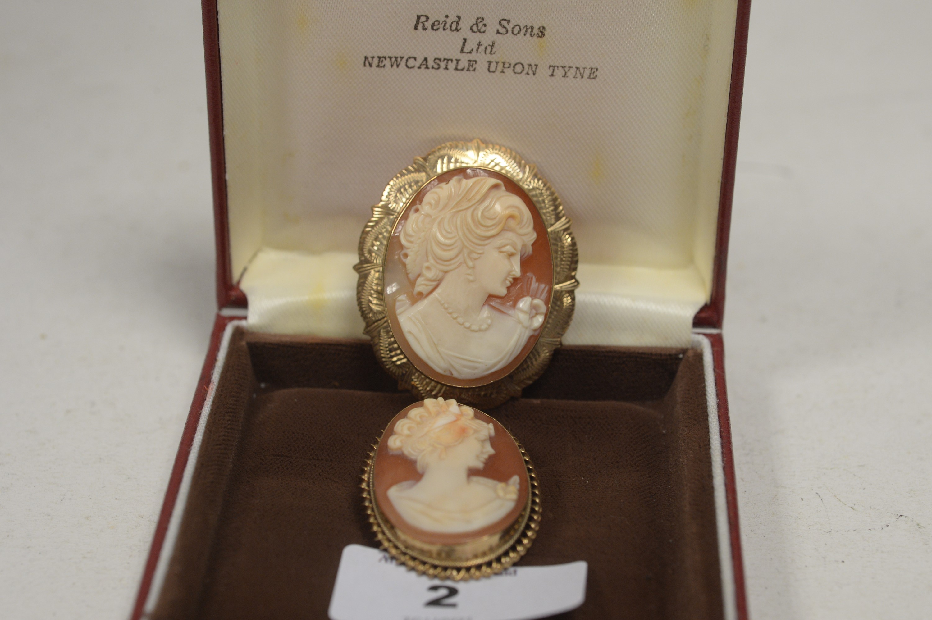 Two cameo brooches.