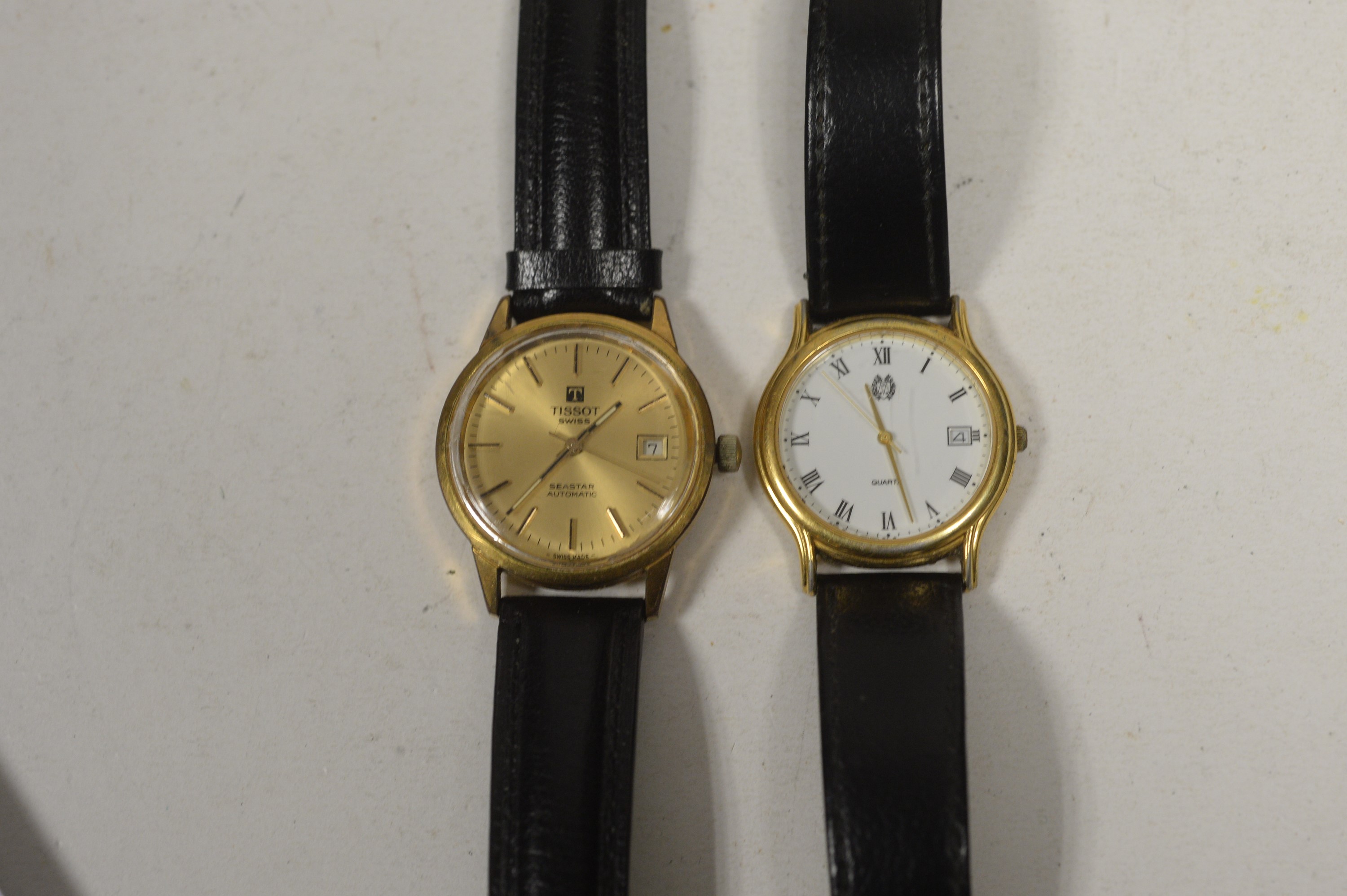 A Tissot wristwatch and another.