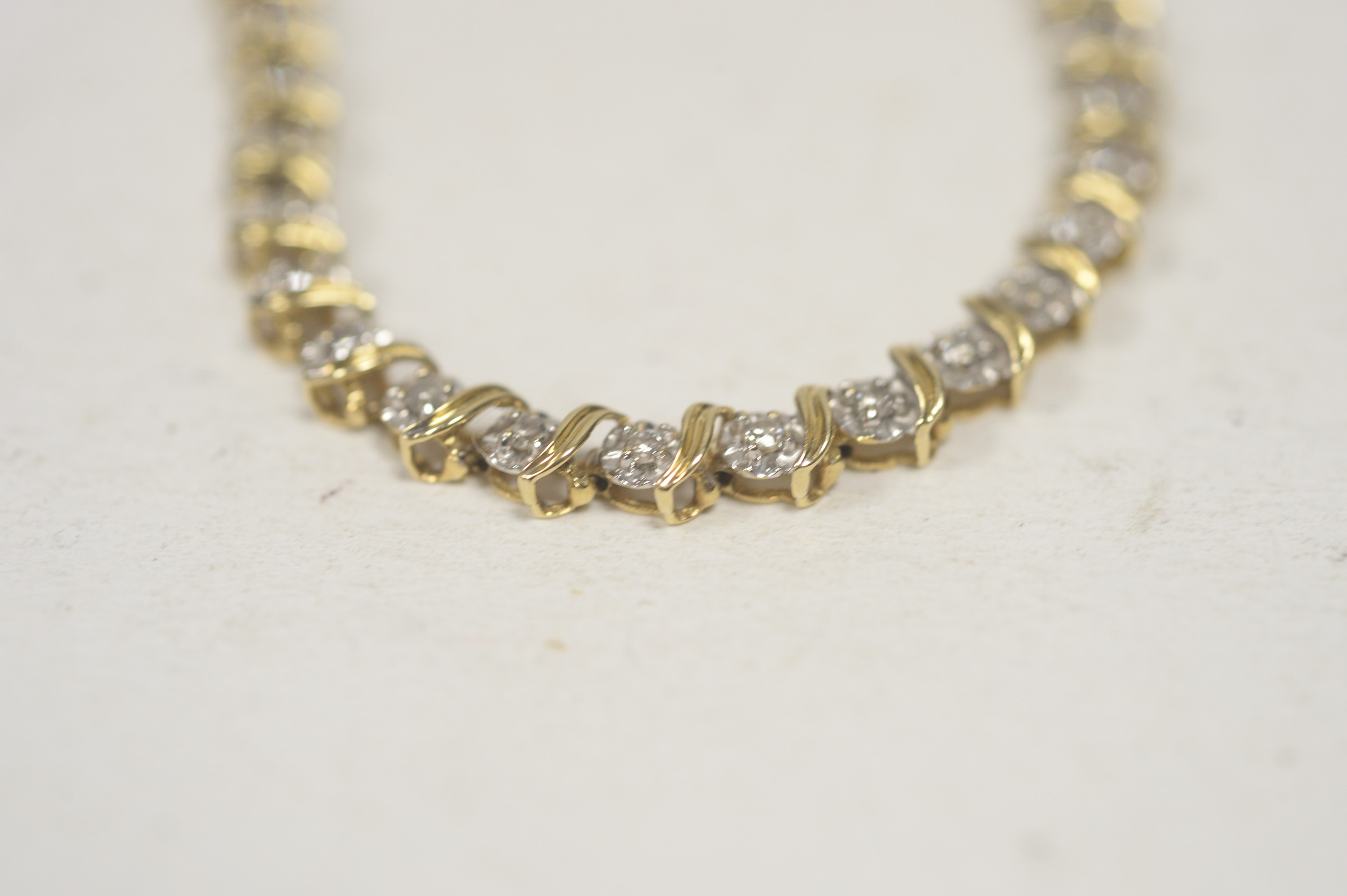 A diamond tennis bracelet.