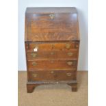 Georgian oak bureau of narrow proportions.