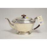 A silver teapot.