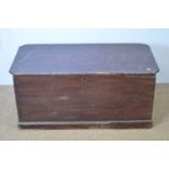 A vintage stained pine trunk, canted rectangular, with metal carrying handles, 103 x 52 x 49cms