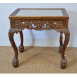 Decorative carved mahogany occasional table.