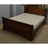 Modern double sleigh bed.