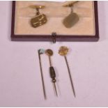 Gold cufflinks and three tie pins