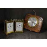 Two brass cased carriage clocks; and a barometer.