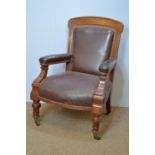 Victorian walnut and leather easy chair.
