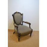 Victorian ebonised easy chair.