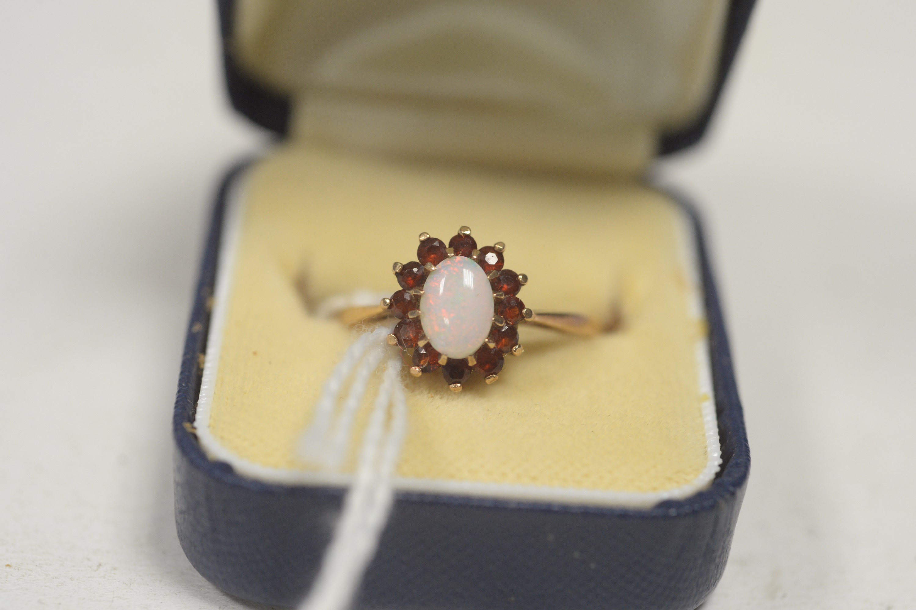 An opal and garnet cluster ring. - Image 3 of 3