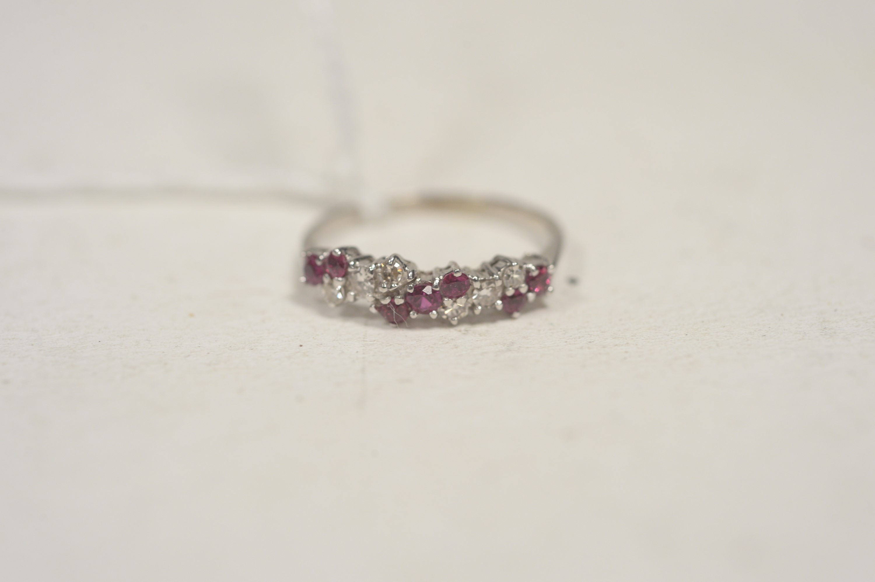 A diamond and ruby ring.