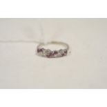 A diamond and ruby ring.