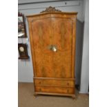 A 20th C walnut wardrobe.