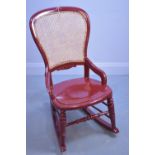 Red painted rocking chair.