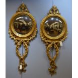 A pair of modern convex mirrors.