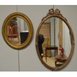 Two gilt framed mirrors.