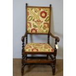 17th Century style carved oak open arm chair.