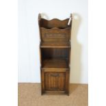 Carved oak magazine rack/cabinet.