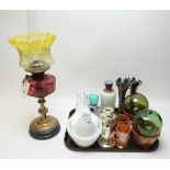 An oil lamp; a glass nesting hen terrine; and other glassware