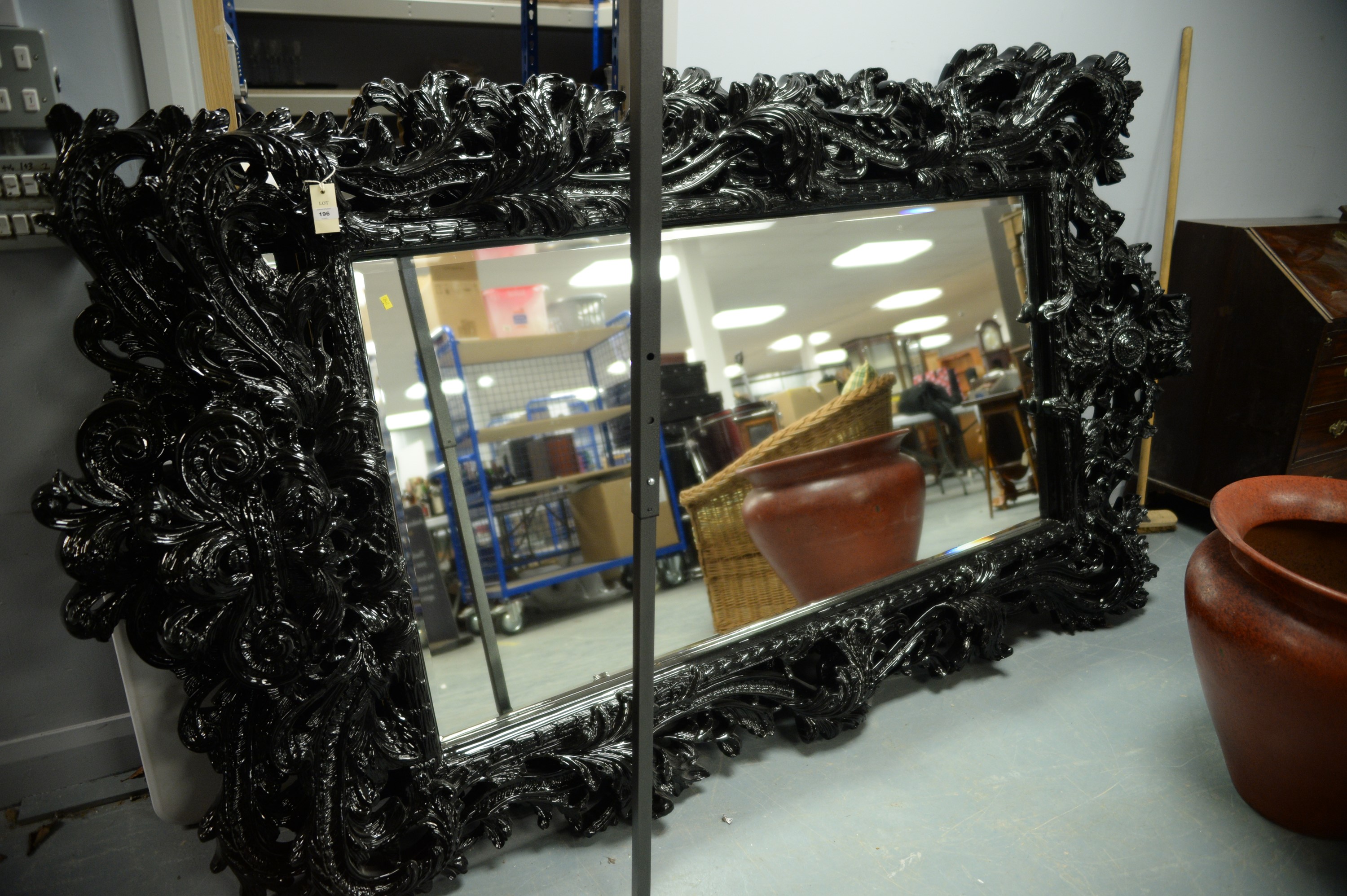 Large and ornate rococo style wall mirror.