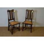 Pair of 17th Century style oak hall chairs.