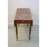 An early 19th Century mahogany Pembroke table