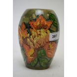 Moorcroft tube lined floral vase.