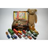 A selection of Dinky toy vehicles and other toys.