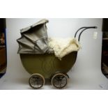 Early 20th C doll's pram, two dolls and two soft toys.