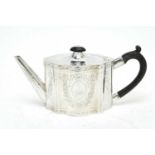 A George III silver teapot.