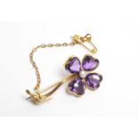 An amethyst and pearl flower pattern brooch