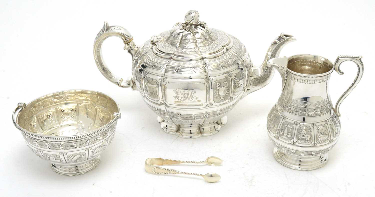 A Victorian silver teapot, with associated sugar basket and milk jug; and sugar tongs.