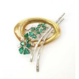 An Art Deco diamond, emerald and yellow metal brooch.