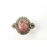 A black opal and diamond cluster ring.