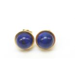 A pair of lapis lazuli stud earrings.