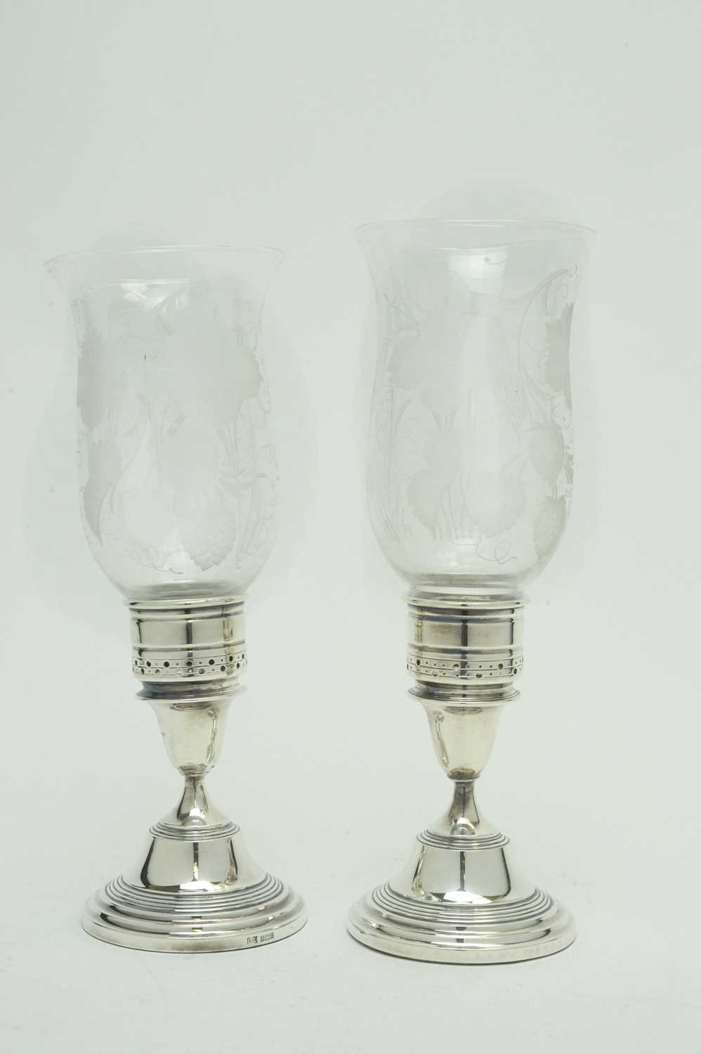 A pair of Elizabeth II silver candlesticks.