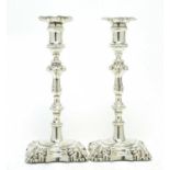 A pair of early Victorian silver candlesticks