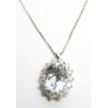 An aquamarine and diamond cluster pendant