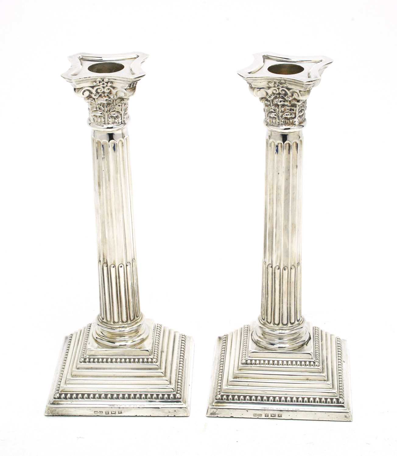 A pair of Elizabeth II silver candlesticks.