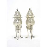 A pair of Victorian silver sugar casters.