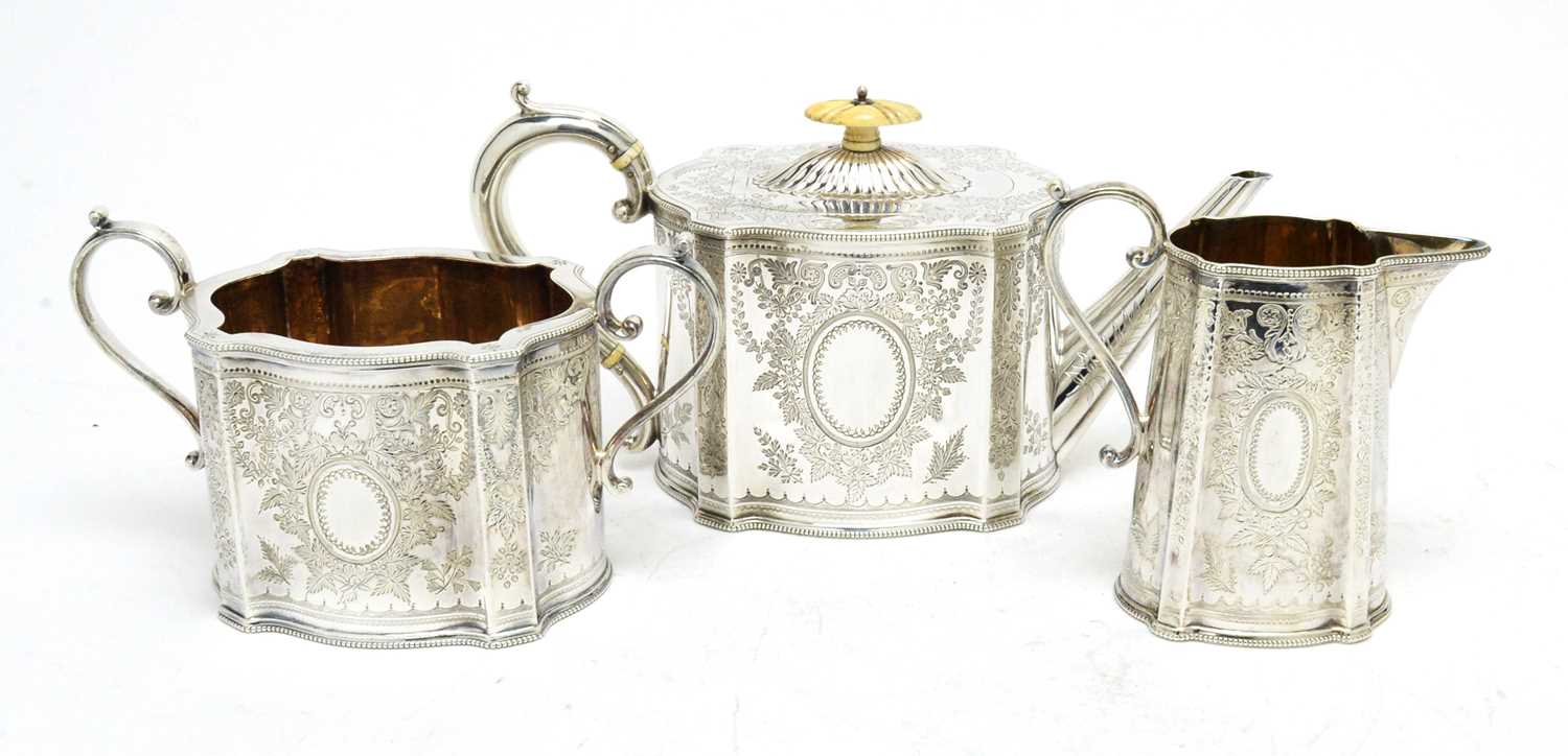 A Victorian silver three-piece tea service.