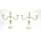 A pair of silver candelabra