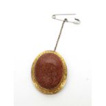 A late 19th Century goldstone brooch.