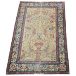 An antique Kirman rug.