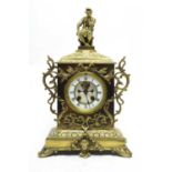 An early 20th C brass-cased mantel clock.
