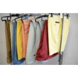 Selection of colourful trousers, and a pair of shorts.