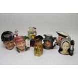 Four Royal Doulton character jugs; and three other jugs.