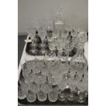 Quantity of cut glass decanters and glasses.