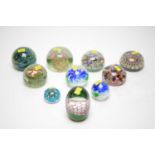 Ten various cut glass paperweights.