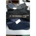 Travel bag; overnight bag; and blue leather handbag.