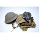 Gas mask; and tin helmet.